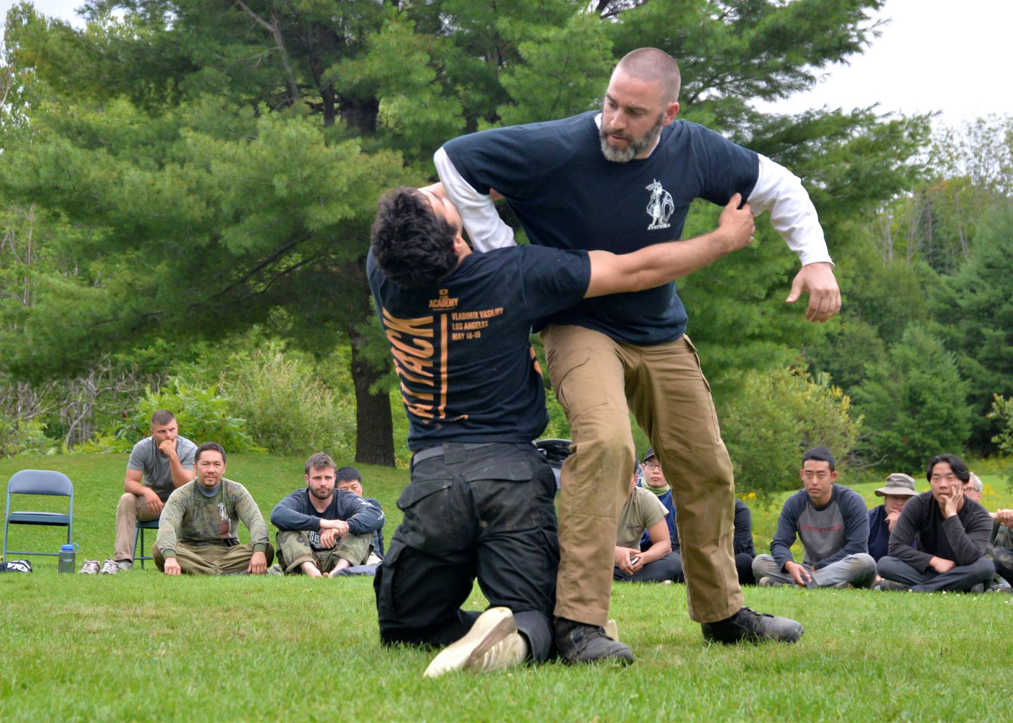 Systema instructor evaluating self-defense technique